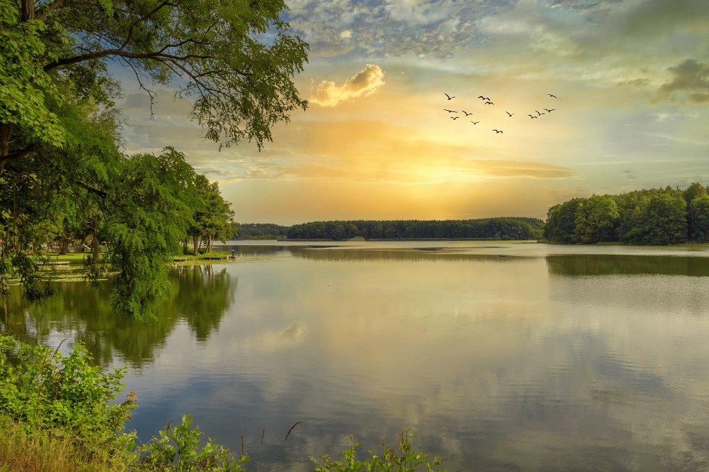 Golden lake at sunrise representing Spirit-Led Encounters at Prayer Power Ministries